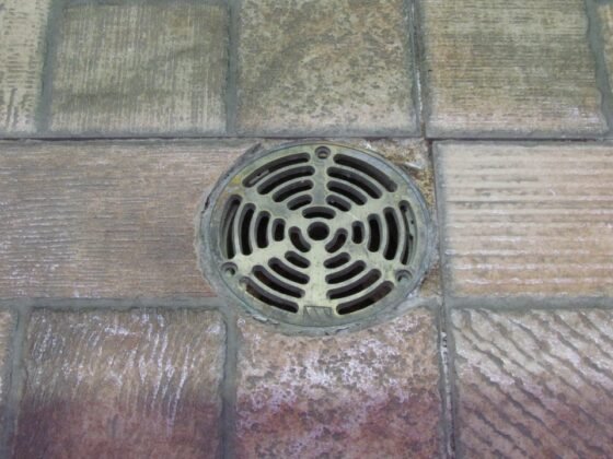 featured image - The Common Causes and Solutions for Slow Drainage in Your Home