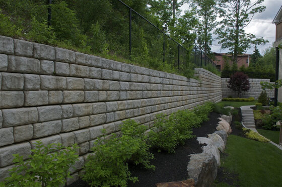 featured image - Benefits of Hiring a Retaining Wall Contractor