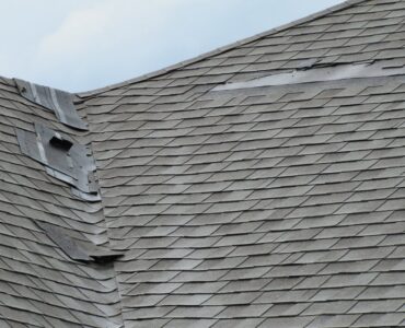 featured image - What are the Common Signs of Roof Hail Damage?