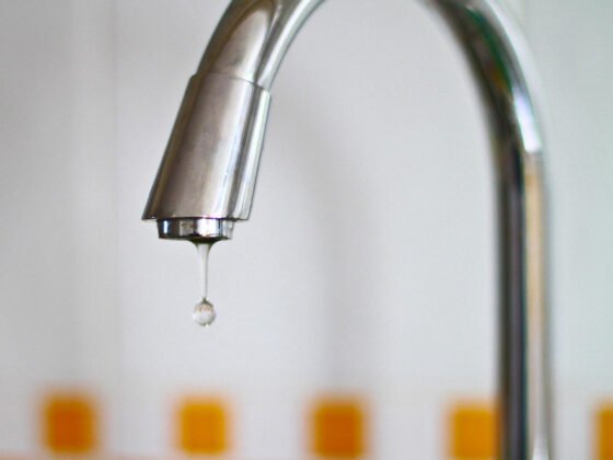 featured image - What Causes a Faucet to Leak
