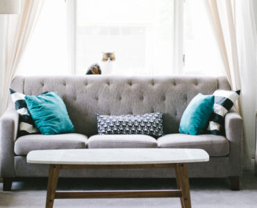 featured image - Learn How to Arrange Pillows on a Couch with These Tips