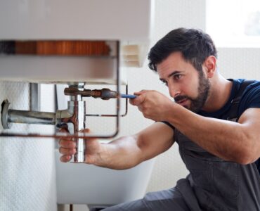 featured image - 6 Ways to Save Money on Plumbing Repairs