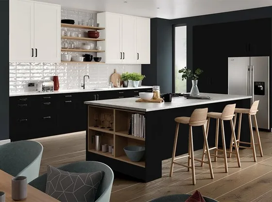 A modern kitchen with a stylish mix of black and white cabinets.