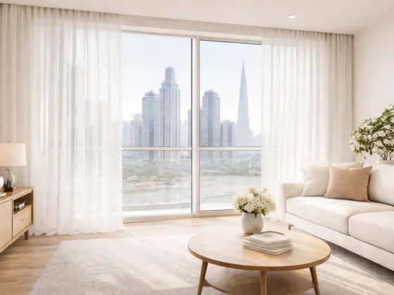 Sunlit modern Dubai living room with sheer white curtains and floor-to-ceiling windows overlooking the city skyline
