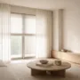 Layered sheer curtains and roman blinds regulating daylight in a minimalist interior space