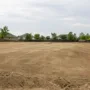 cleared residential lot prepared for home construction in a suburban neighborhood