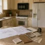 kitchen in planning stage with layout sketches and measuring tools