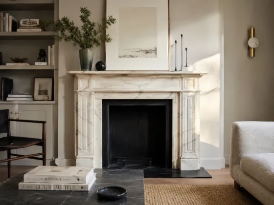 Antique marble mantelpiece in a contemporary living room