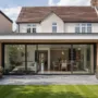 Modern rear home extension added to an existing family house