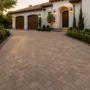 Luxury herringbone paver driveway with charcoal border enhancing curb appeal
