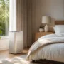 Modern bedroom with an air purifier beside the bed to improve indoor air quality for better sleep