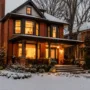 Classic double-brick older Ontario home showing winter energy efficiency and cozy indoor lighting